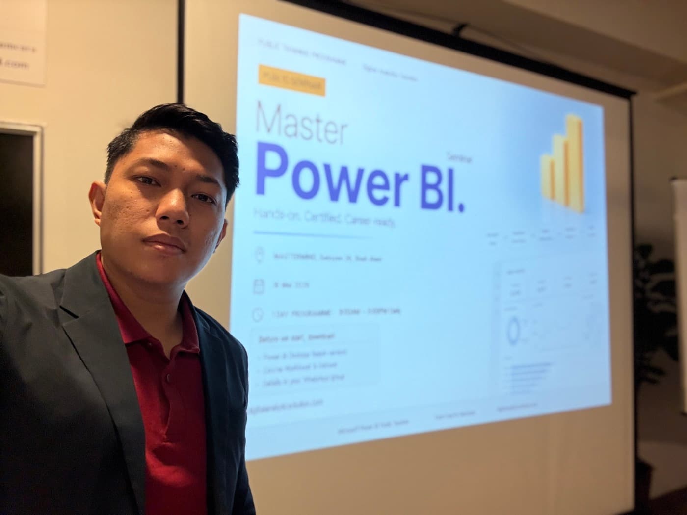 Hariz Sharif beside a Master Power BI seminar slide