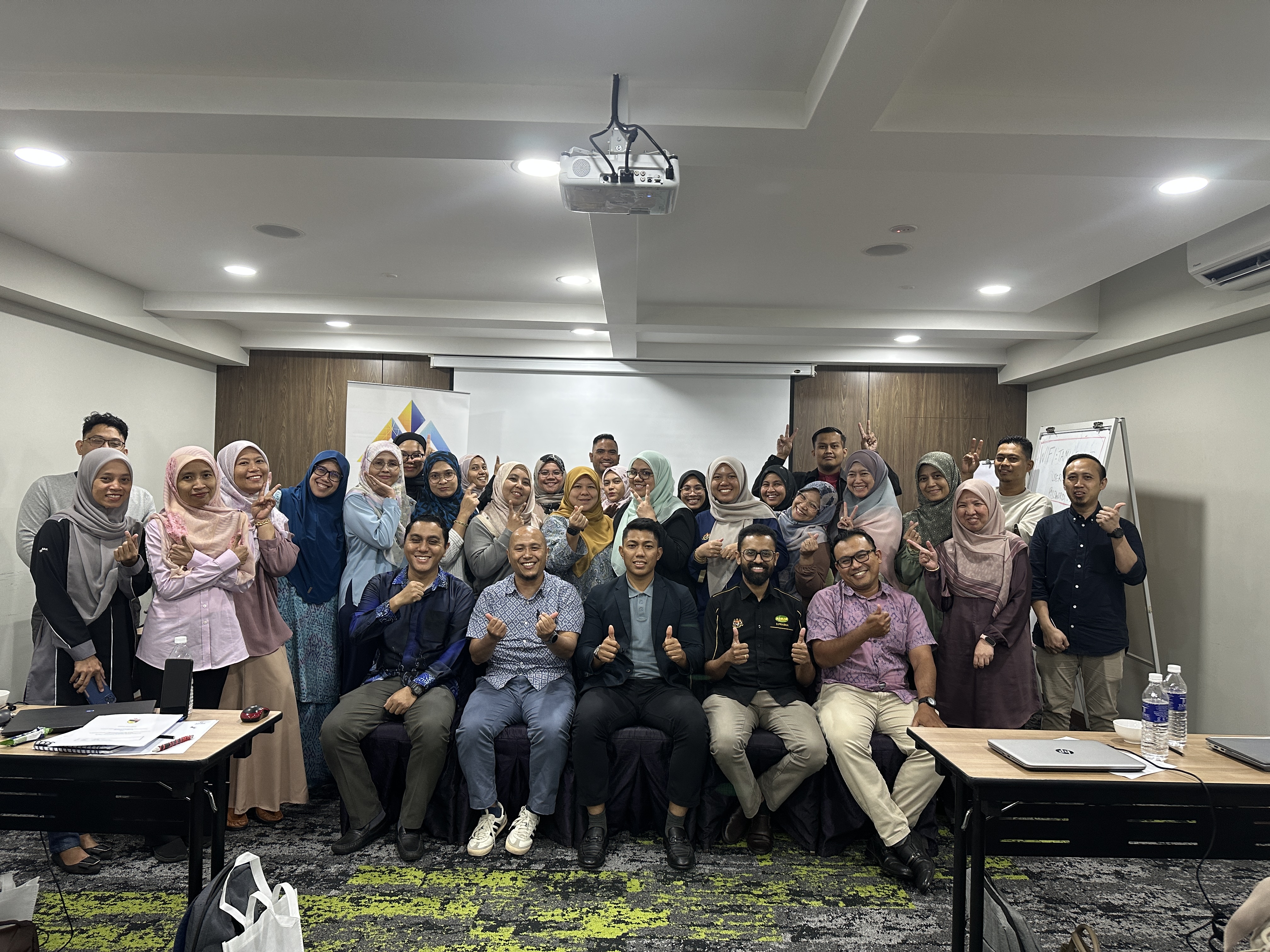 Group training workshop with trainer presenting to professionals