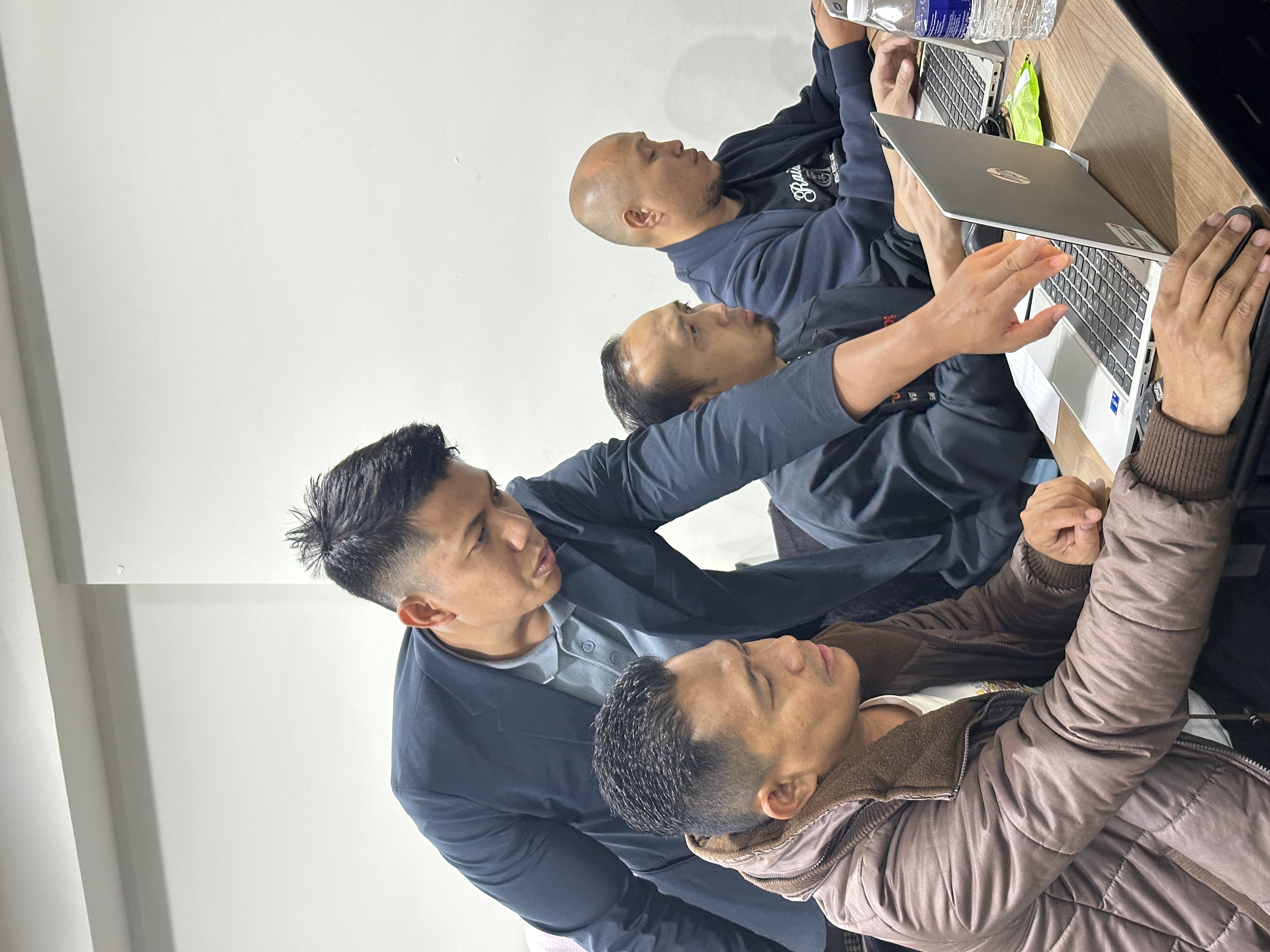 Participants working hands-on with laptops
